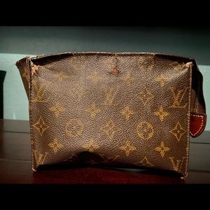 Very well loved Louis Vuitton makeup bag